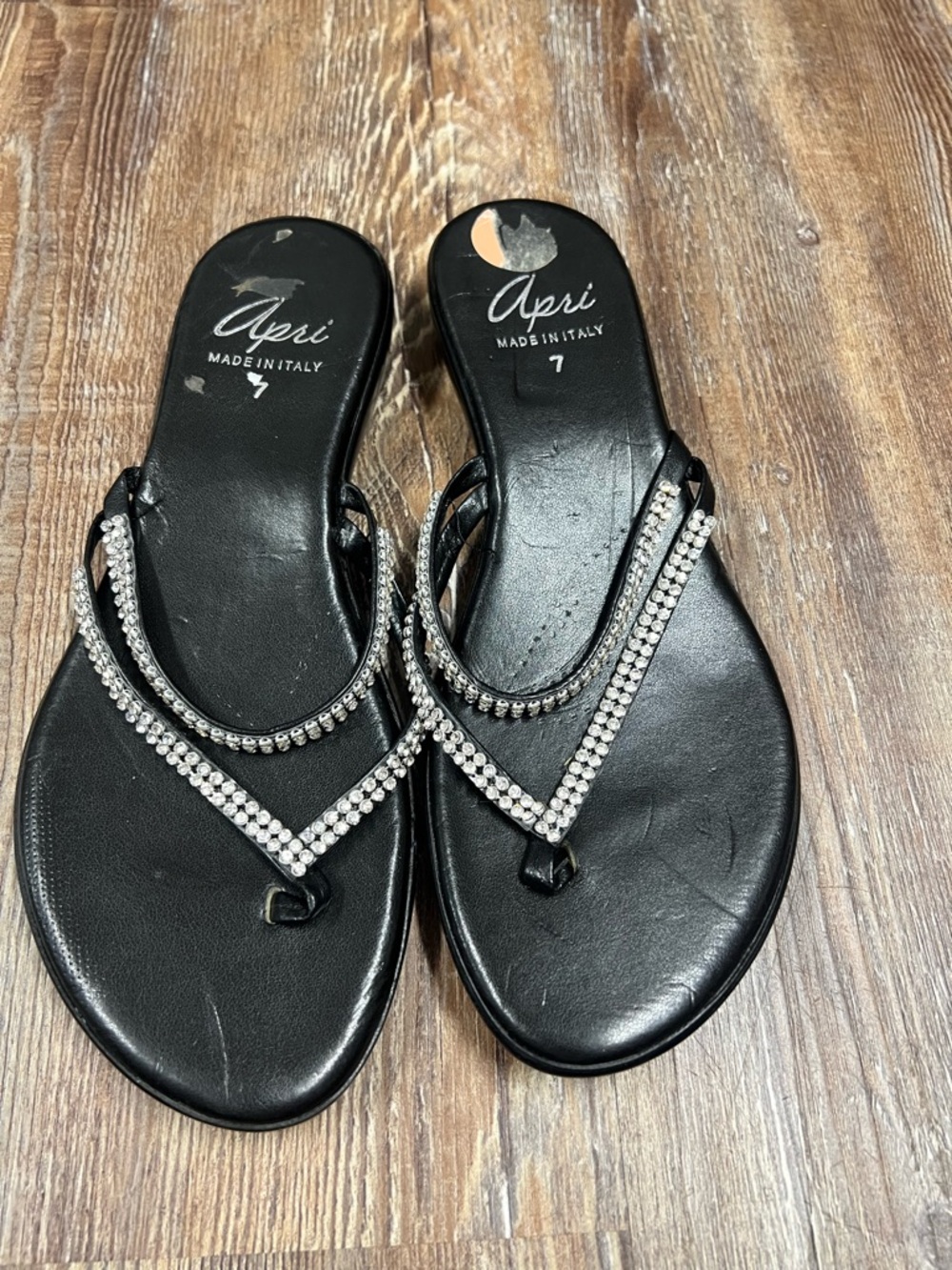 Y2K Apri black leather sandals with silver rhinestone embellishments.